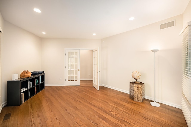 2002 Valleyview Dr, Ann Arbor, MI 48105 - empty room with wood finished floors, recessed lighting, and french doors