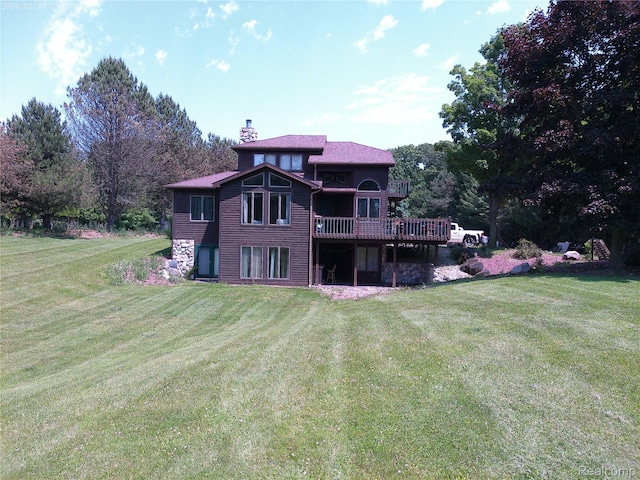 6140 Mcguire Rd, Fenton, MI 48430 - back of property featuring a chimney and a lawn