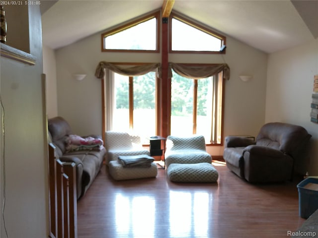 6140 Mcguire Rd, Fenton, MI 48430 - living room with wood finished floors and vaulted ceiling