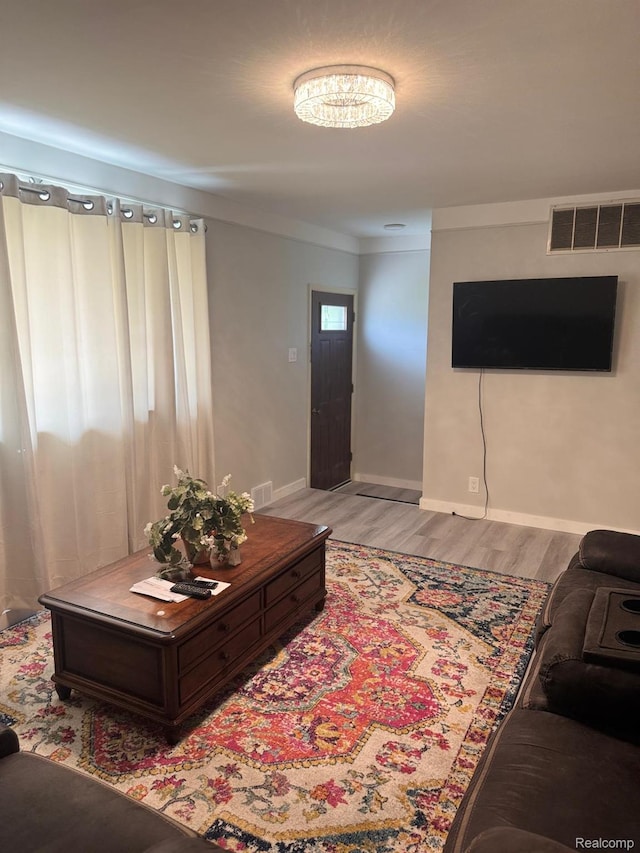 21451 N Nunneley Rd, Shelby Twp, MI 48036 - living room with light wood-style flooring and baseboards