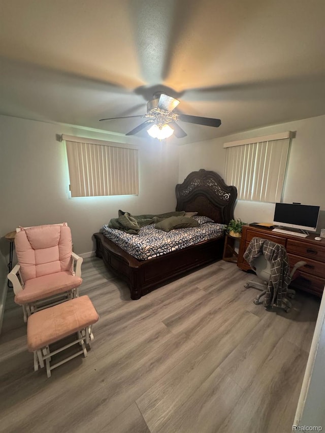 21451 N Nunneley Rd, Shelby Twp, MI 48036 - bedroom with wood finished floors and a ceiling fan