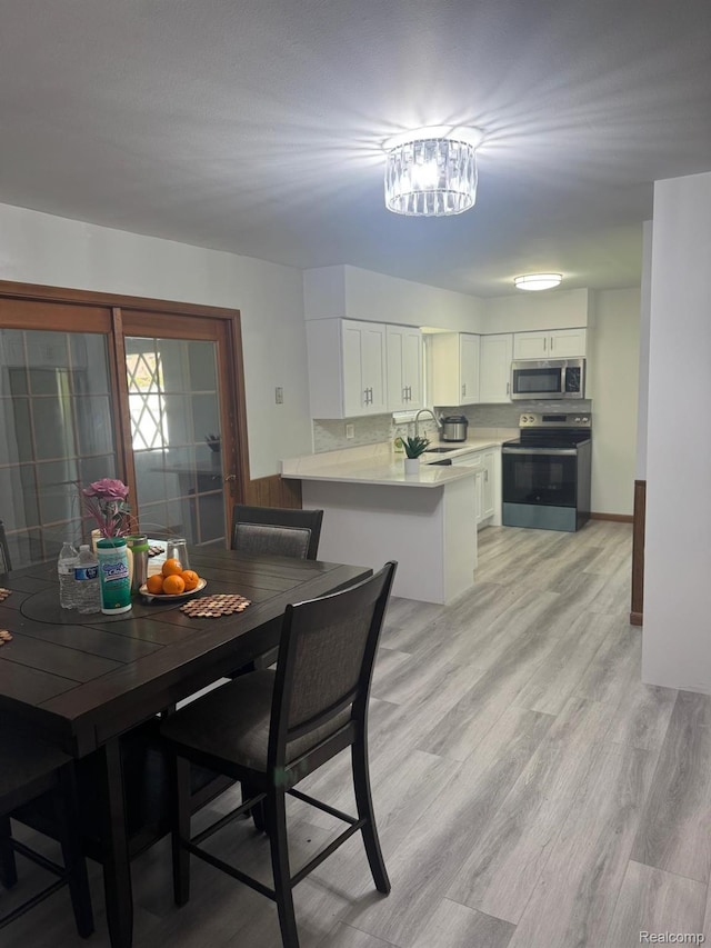 21451 N Nunneley Rd, Shelby Twp, MI 48036 - dining room with light wood-style floors