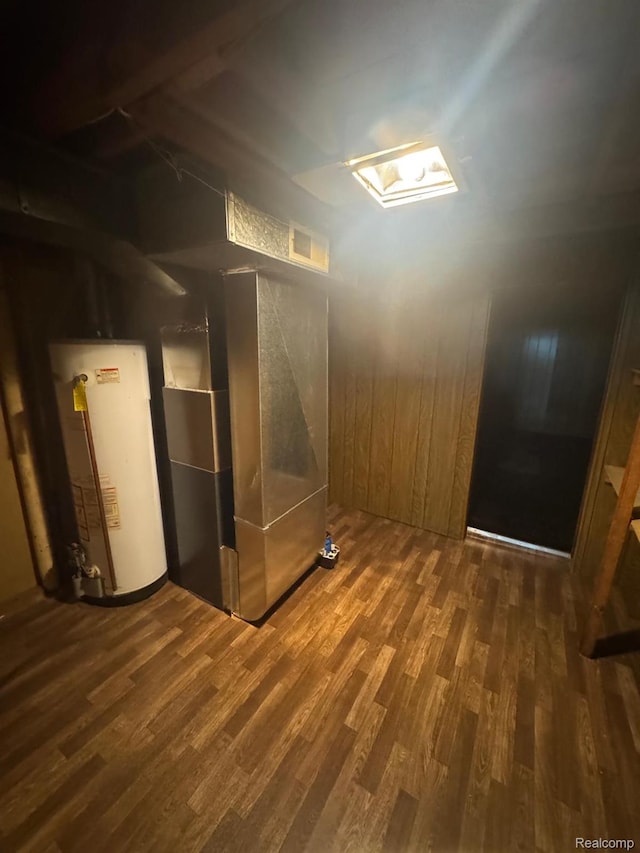 21451 N Nunneley Rd, Shelby Twp, MI 48036 - below grade area featuring gas water heater and wood finished floors