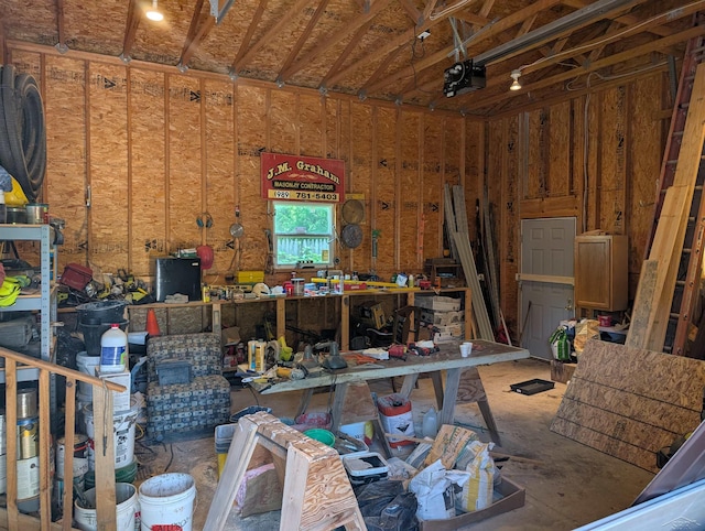 1712 S Hamilton St, Saginaw, MI 48602 - garage with a workshop area and a garage door opener