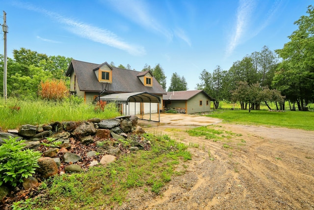 21759 205th Ave, Paris, MI 49338 - view of front of property with dirt driveway and a carport