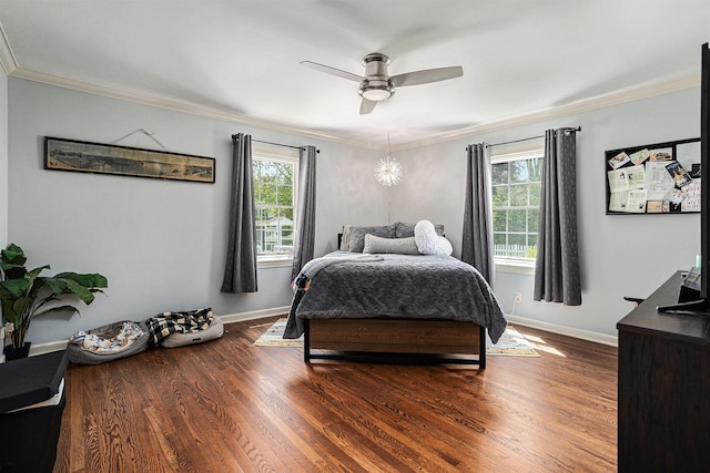 3225 Bronson Blvd, Kalamazoo, MI 49008 - bedroom featuring crown molding, baseboards, dark wood-type flooring, and ceiling fan