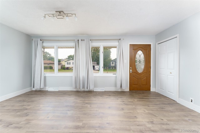 3260 Van Campen Dr, Waterford, MI 48329 - entryway with wood finished floors and baseboards