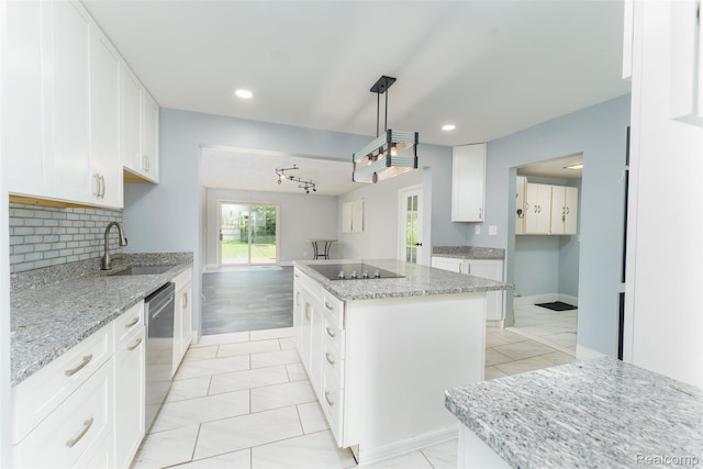 3260 Van Campen Dr, Waterford, MI 48329 - kitchen featuring a sink, black electric cooktop, a center island, stainless steel dishwasher, and white cabinetry