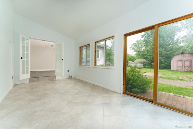 3260 Van Campen Dr, Waterford, MI 48329 - empty room featuring vaulted ceiling and baseboards