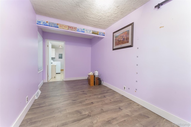 3260 Van Campen Dr, Waterford, MI 48329 - empty room with a textured ceiling, light wood finished floors, and baseboards