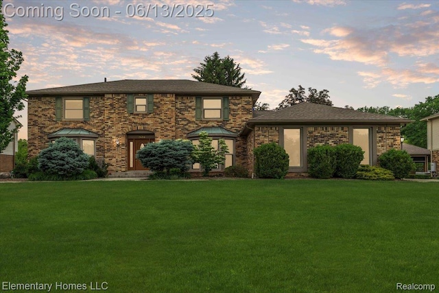 2456 Red Maple Dr, Troy, MI 48098 - view of front facade with a yard and brick siding