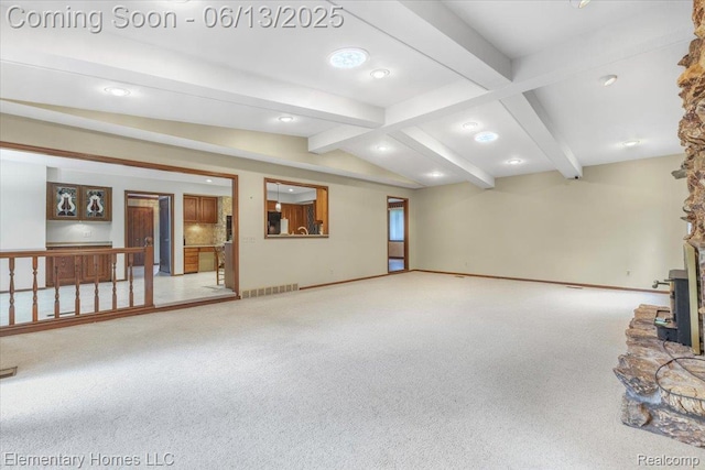 2456 Red Maple Dr, Troy, MI 48098 - below grade area featuring carpet floors, a wood stove, and recessed lighting