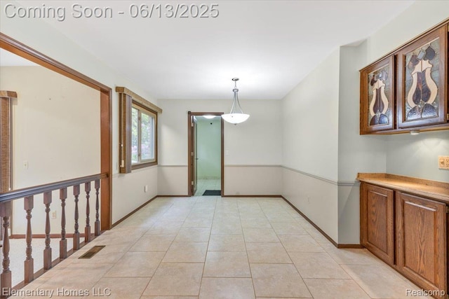 2456 Red Maple Dr, Troy, MI 48098 - unfurnished room with baseboards and light tile patterned floors