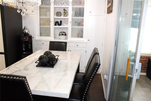 5095 Camborne Ct, Flint, MI 48504 - dining room with a chandelier and wood finished floors