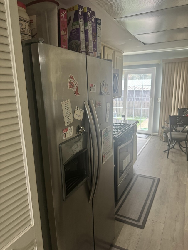 25045 Glenbrooke Dr, Southfield, MI 48033 - kitchen with appliances with stainless steel finishes, light wood-type flooring, and white cabinets