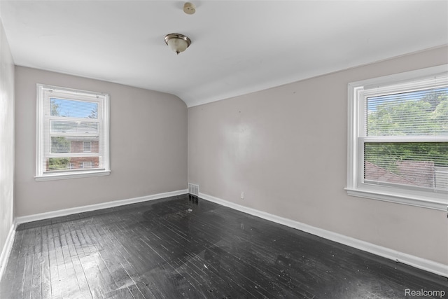 11603 Lansdowne St, Detroit, MI 48224 - empty room featuring plenty of natural light, dark wood finished floors, and lofted ceiling