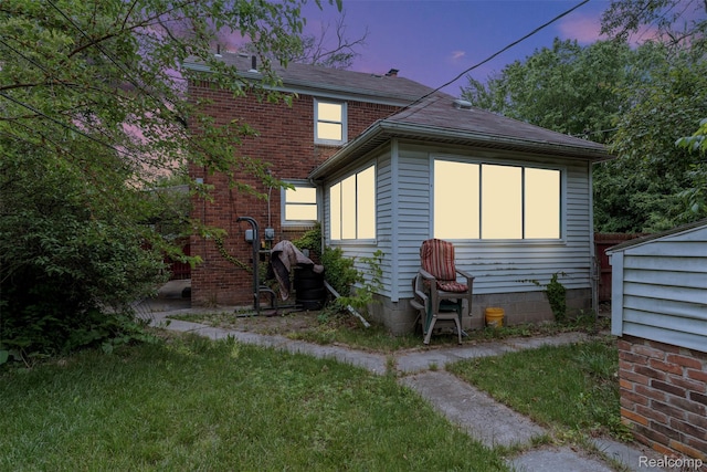 11603 Lansdowne St, Detroit, MI 48224 - back of property at dusk with a shingled roof