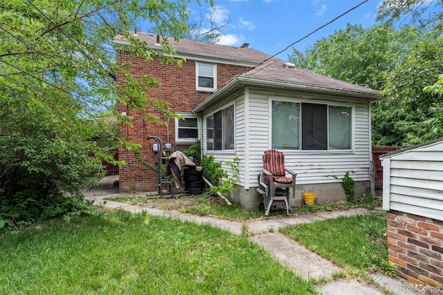 11603 Lansdowne St, Detroit, MI 48224 - back of house featuring roof with shingles