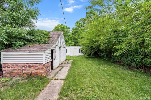 11603 Lansdowne St, Detroit, MI 48224 - view of green lawn with a shed