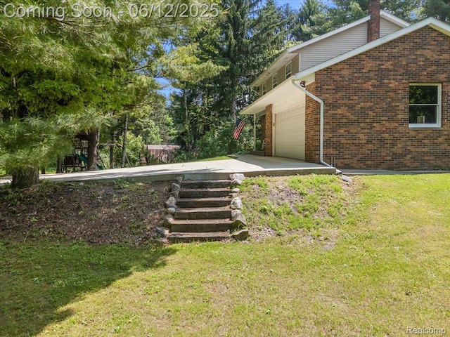 5836 Ewalt Rd, Imlay City, MI 48444 - view of green lawn with a garage