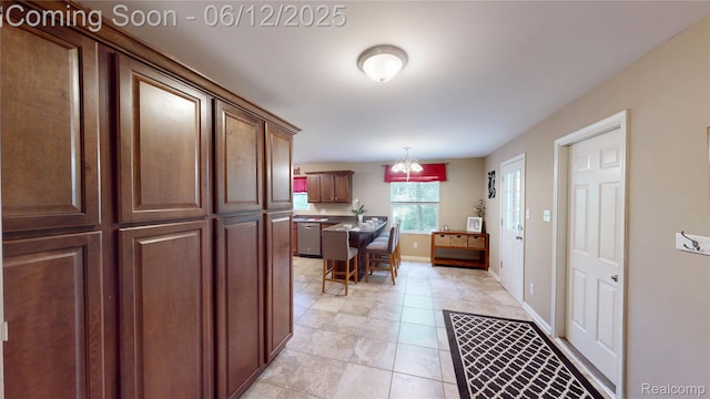 5836 Ewalt Rd, Imlay City, MI 48444 - kitchen featuring dishwasher, hanging light fixtures, and light tile patterned flooring