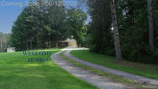 5836 Ewalt Rd, Imlay City, MI 48444 - view of community with a yard and driveway