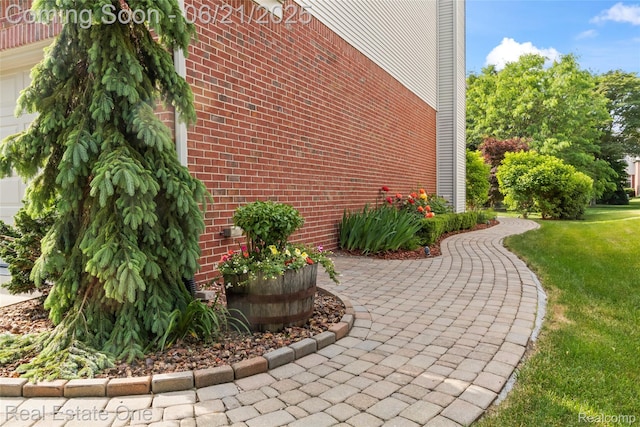 7244 Millrock Ave, Shelby Twp, MI 48317 - view of property exterior with brick siding and a yard