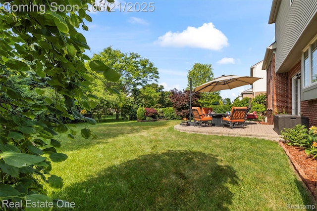 7244 Millrock Ave, Shelby Twp, MI 48317 - view of grassy yard featuring a patio and a fire pit