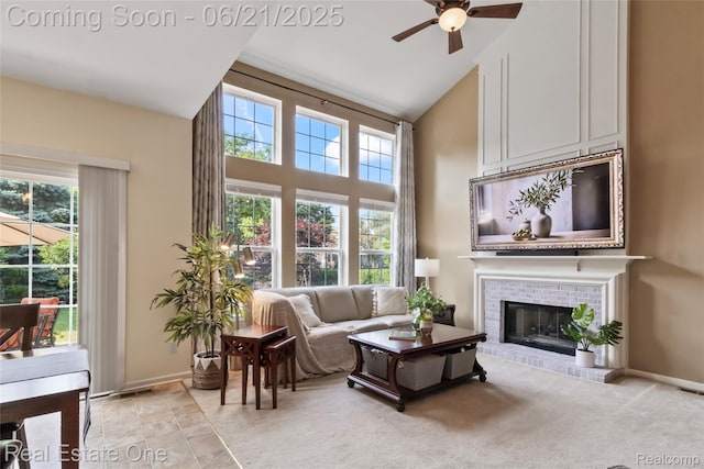7244 Millrock Ave, Shelby Twp, MI 48317 - living area featuring high vaulted ceiling, ceiling fan, healthy amount of natural light, and a fireplace