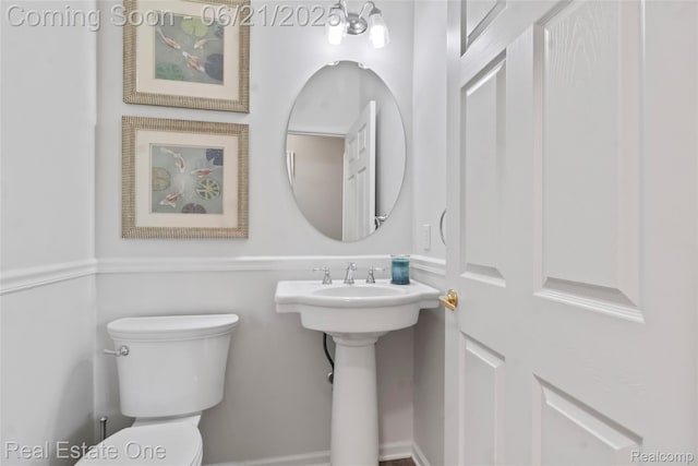 7244 Millrock Ave, Shelby Twp, MI 48317 - half bathroom with toilet and a sink