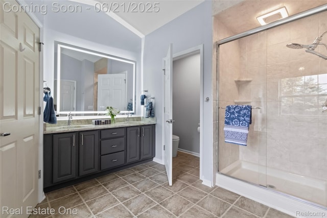 7244 Millrock Ave, Shelby Twp, MI 48317 - full bathroom with double vanity, a stall shower, and tile patterned floors