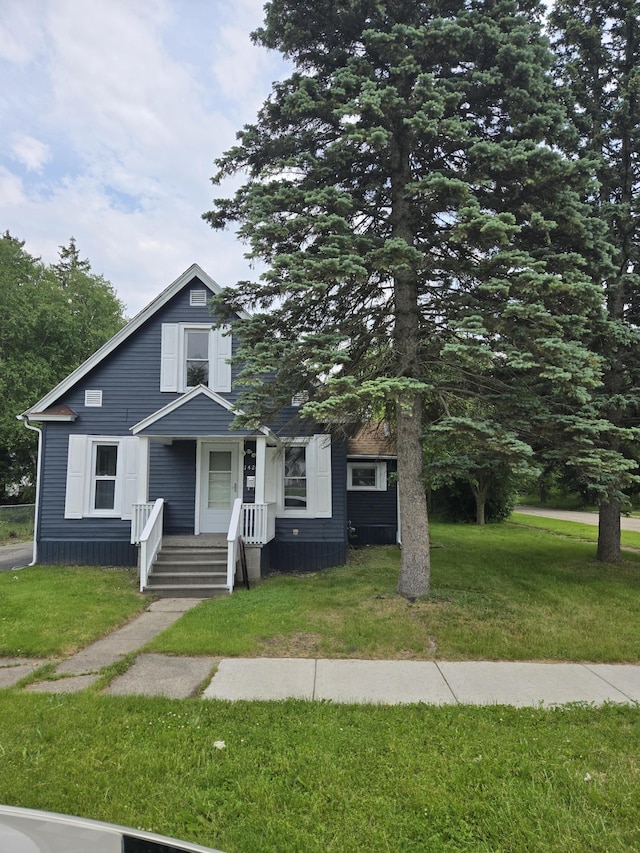 1420 Sweet St, Saginaw, MI 48602 - view of front of property with a front lawn and a porch