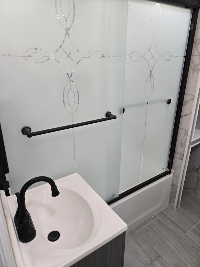 1420 Sweet St, Saginaw, MI 48602 - bathroom with combined bath / shower with glass door and vanity