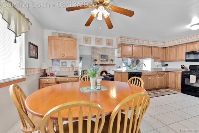 3039 Elmcrest Rd, Sterling Heights, MI 48310 - dining space featuring ceiling fan, light tile patterned floors, and a brick fireplace