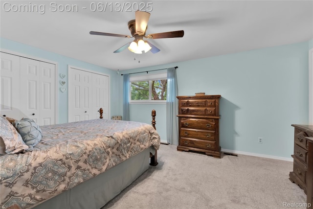 3039 Elmcrest Rd, Sterling Heights, MI 48310 - carpeted bedroom with two closets and a ceiling fan