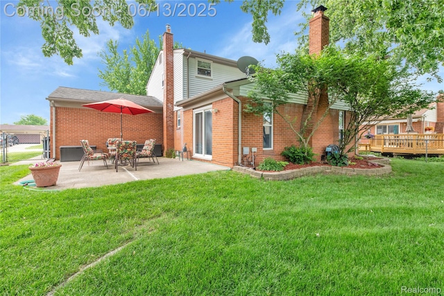 3039 Elmcrest Rd, Sterling Heights, MI 48310 - rear view of house featuring brick siding, a chimney, a patio, and a deck