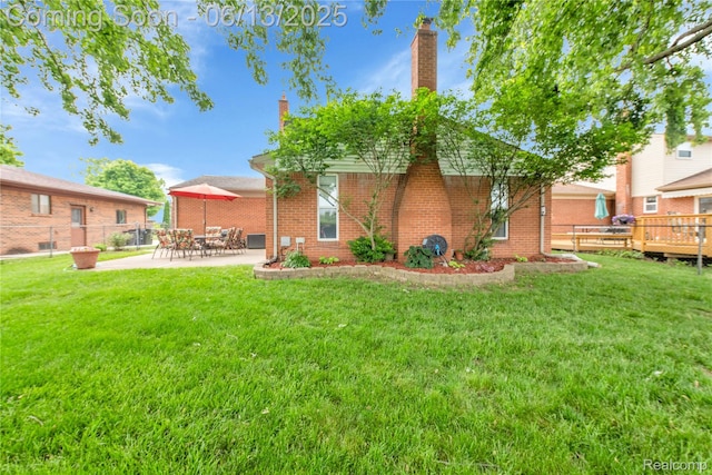 3039 Elmcrest Rd, Sterling Heights, MI 48310 - rear view of house featuring a patio area, brick siding, and a chimney