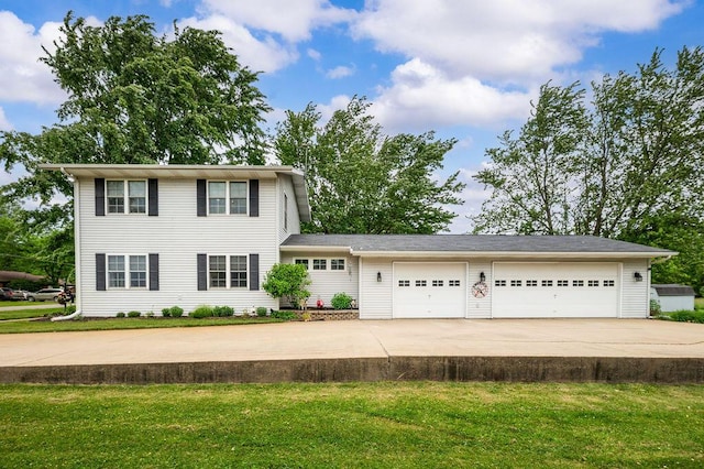 5549 Newton Ave, Coloma, MI 49038 - view of front facade with concrete driveway, a front yard, and a garage