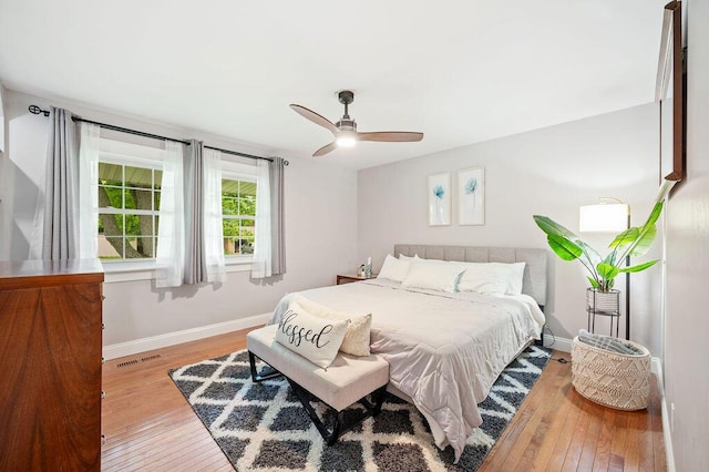 5549 Newton Ave, Coloma, MI 49038 - bedroom featuring hardwood / wood-style flooring, baseboards, and a ceiling fan