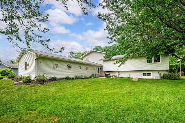5549 Newton Ave, Coloma, MI 49038 - rear view of property with a lawn and central air condition unit