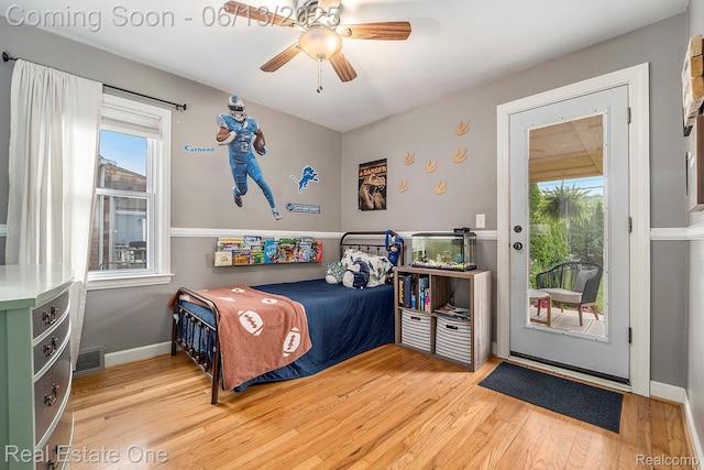 122 N Wilson Ave, Royal Oak, MI 48067 - bedroom featuring access to outside, multiple windows, wood finished floors, and ceiling fan