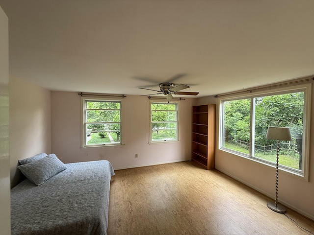 601 Cressfield Ln, Ann Arbor, MI 48103 - bedroom featuring light wood finished floors, baseboards, and a ceiling fan
