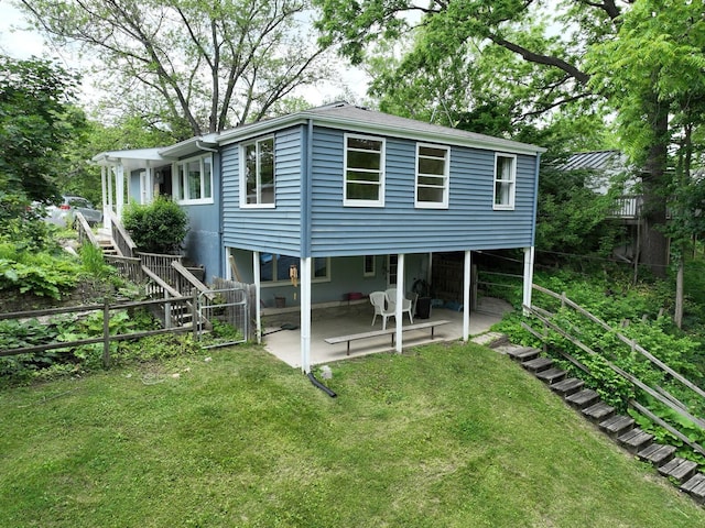 601 Cressfield Ln, Ann Arbor, MI 48103 - back of property featuring stairway and a patio area