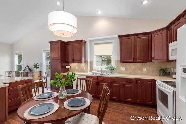 971 Aberdeen Way, Hudsonville, MI 49426 - kitchen featuring white appliances, healthy amount of natural light, tasteful backsplash, high vaulted ceiling, and recessed lighting