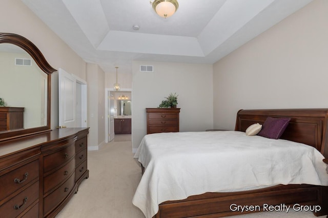 971 Aberdeen Way, Hudsonville, MI 49426 - bedroom featuring a tray ceiling, light colored carpet, and ensuite bathroom