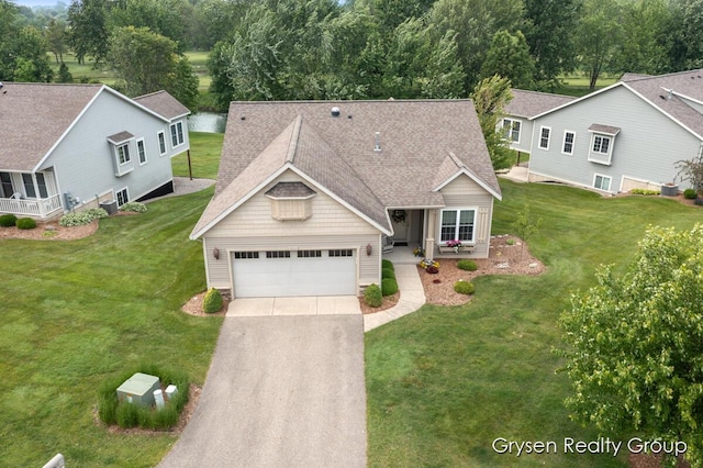 971 Aberdeen Way, Hudsonville, MI 49426 - view of front facade with asphalt driveway, a front lawn, a shingled roof, and a porch