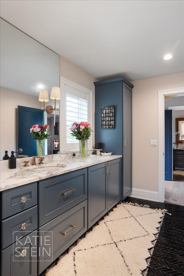 1110 Breton Rd SE, East Grand Rapids, MI 49506 - bathroom with double vanity and wood finished floors