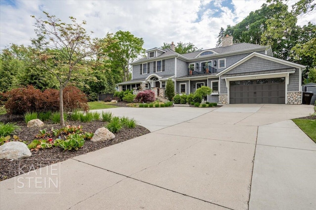 1110 Breton Rd SE, East Grand Rapids, MI 49506 - shingle-style home with driveway, stone siding, a garage, and a chimney