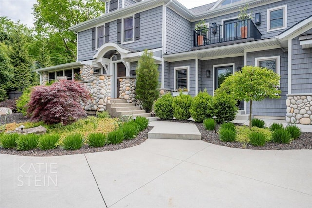 1110 Breton Rd SE, East Grand Rapids, MI 49506 - view of front of house featuring a balcony and stone siding