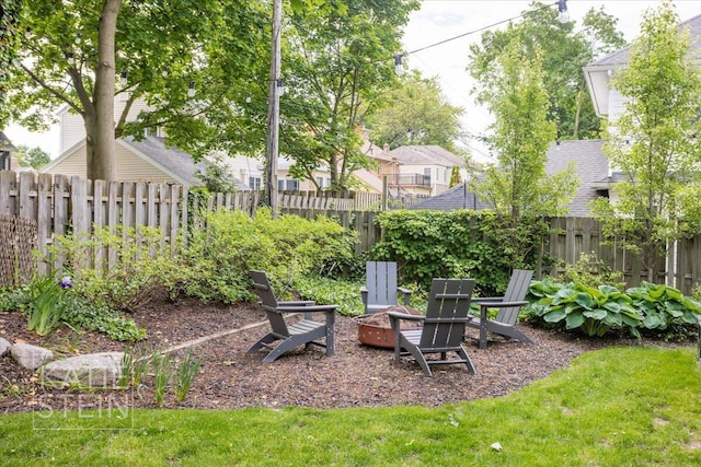 1110 Breton Rd SE, East Grand Rapids, MI 49506 - fenced backyard with an outdoor fire pit
